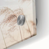 Large abstract wall art in vibrant orange and yellow tones on acrylic glass.