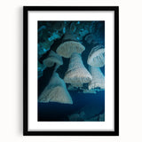 Framed landscape artwork showcasing a stunning cave scene in rich earthy tones, with a sleek black mat and frame, perfect for enhancing home decor.