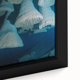 Close-up of a beautifully framed canvas artwork depicting a vibrant landscape of caves, showcasing rich colors and intricate details, perfect for home decor.