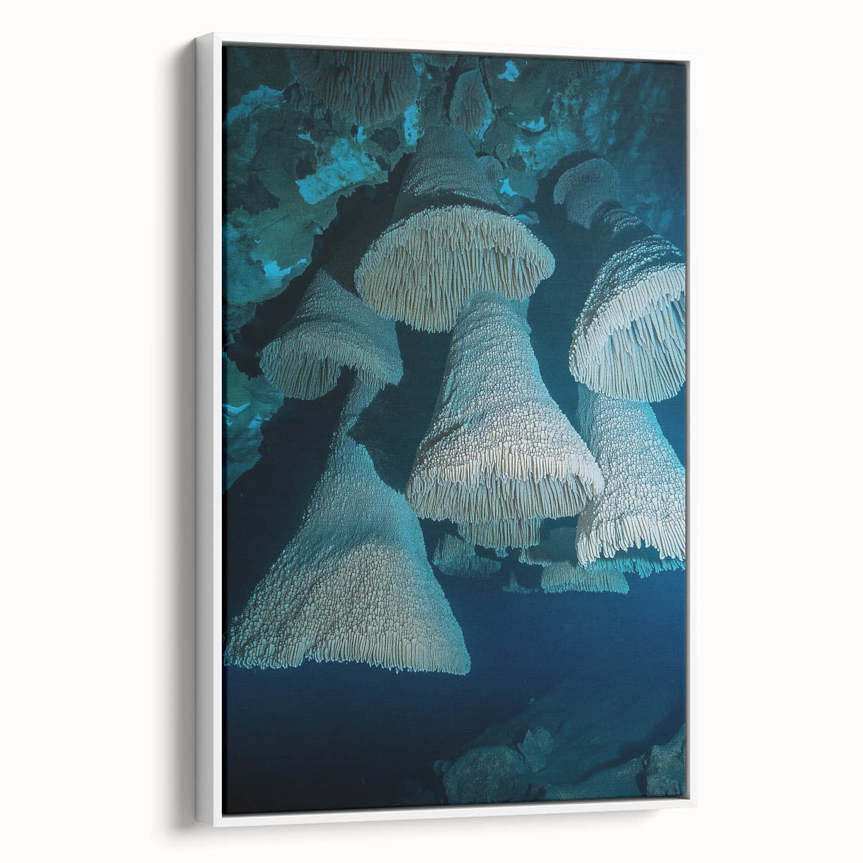 Framed canvas artwork depicting a serene landscape with caves, featuring soft earth tones and intricate details. The piece is elegantly displayed with a white frame, perfect for enhancing home decor.