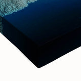 Close-up of a stretched canvas artwork depicting a scenic landscape with vibrant colors and intricate cave details, ideal for home decor and art enthusiasts.