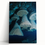 Stretched canvas artwork showcasing a stunning landscape of colorful caves, featuring rich hues of red, orange, and blue. Ideal for enhancing modern decor.