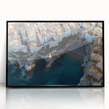 Framed acrylic artwork showcasing a dramatic landscape of rugged cliffs in vibrant colors, set against a sleek black frame, ideal for modern home decor.