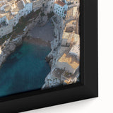 Close-up of a framed canvas depicting a stunning landscape with dramatic cliffs and vibrant colors, enhancing any modern home decor with its artistic appeal.