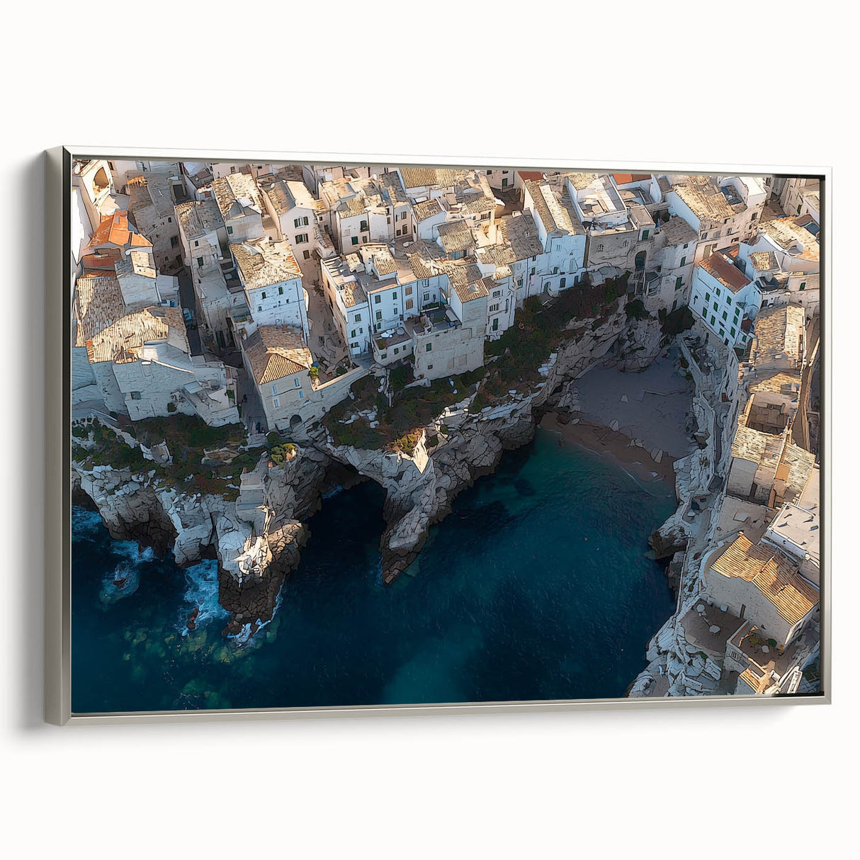 Framed canvas artwork showcasing a stunning landscape of rugged cliffs under a blue sky, featuring a sleek silver frame that enhances its modern aesthetic.