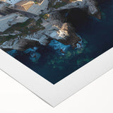 Vibrant rolled canvas artwork depicting a stunning cliff landscape at sunset, showcasing rich colors and textures, ideal for home decor or art installations.