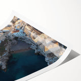 Beautiful landscape print showcasing majestic cliffs against a vibrant sky, rolled for shipping and housed in a durable cardboard tube, ideal for wall decoration.