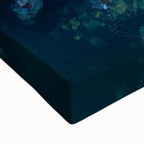 Close-up of a stretched canvas featuring a stunning landscape of dramatic cliffs, showcasing vibrant colors and intricate details, perfect for home decor.