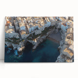 Stretched canvas artwork depicting a breathtaking landscape of majestic cliffs under a vibrant sunset, perfect for home decor or art enthusiasts.