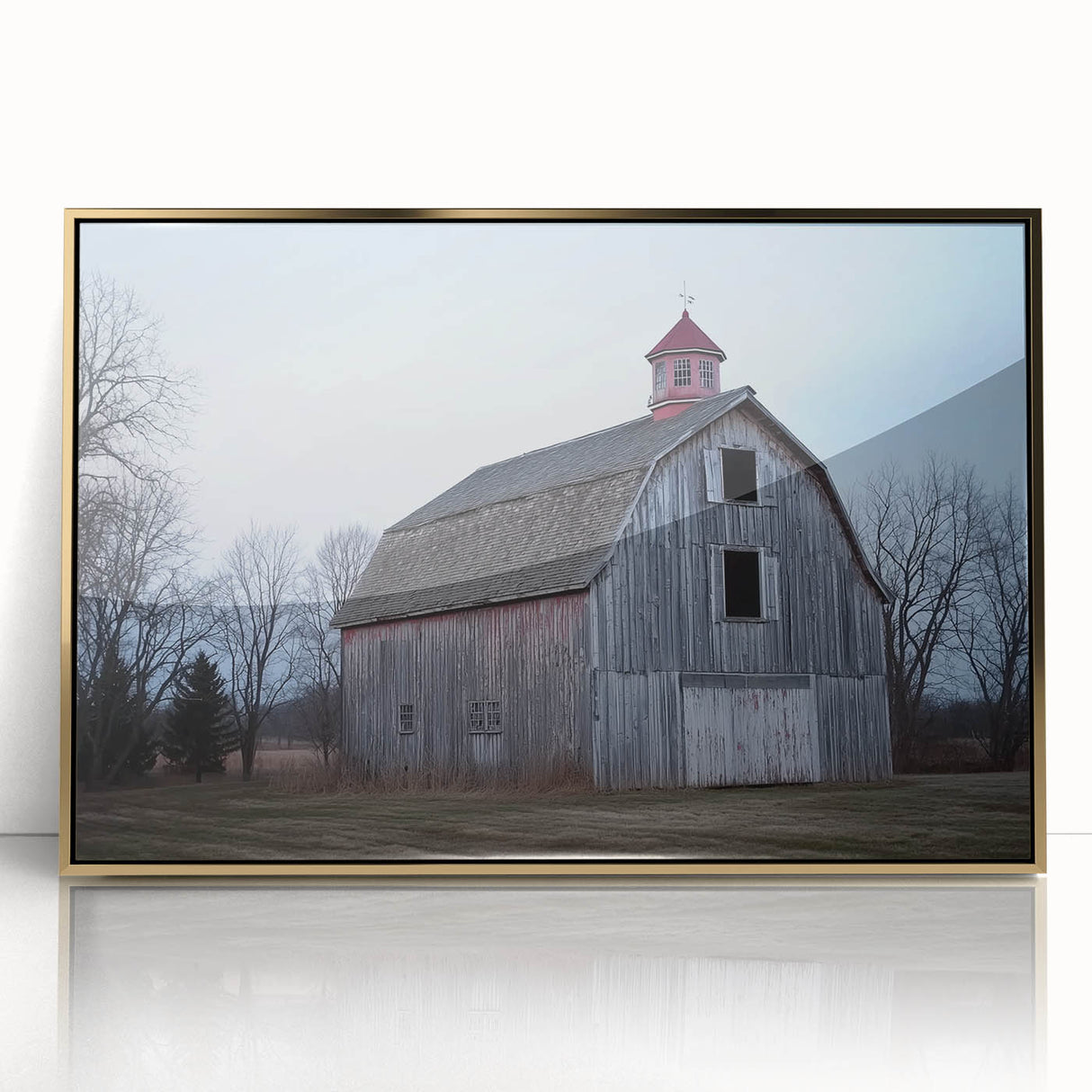 Framed acrylic artwork showcasing a landscape scene of a rustic barn, accented with gold tones, perfect for enhancing home decor with a warm, inviting ambiance.