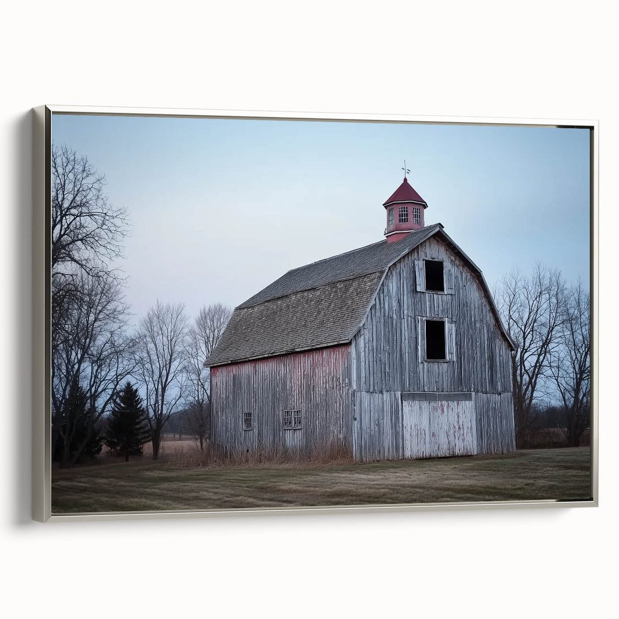 Silver-framed landscape canvas artwork showcasing a serene barn scene, highlighting vibrant colors and intricate details, ideal for rustic home decor.