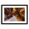 Black-framed landscape art print depicting vibrant canyons, featuring a white mat for added elegance, perfect for modern home decor or office spaces.