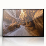 Framed acrylic artwork showcasing a stunning landscape of canyons in vibrant colors, set against a sleek black frame, ideal for modern home decor.