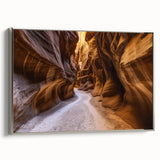 Framed landscape canvas showcasing a stunning view of canyons in rich earth tones, featuring a sleek silver frame that enhances the artwork's depth and detail. Perfect for adding a touch of nature-inspired elegance to any living space or office decor.