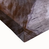 Close-up of a stretched canvas artwork depicting vibrant canyons in rich earth tones, showcasing intricate textures and details, perfect for home decor enthusiasts.