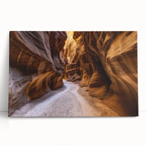 Vibrant landscape canvas print showcasing majestic canyons in rich earthy tones, elegantly leaning against a wall, perfect for home decor enthusiasts.