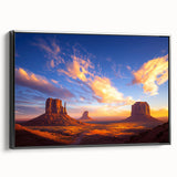 Framed canvas print of a desert landscape featuring warm tones of orange and brown, set against a sleek black frame, ideal for home decor and modern aesthetics.
