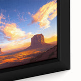 Close-up of a framed canvas artwork depicting a serene desert landscape, showcasing warm tones of orange and beige with textured brushstrokes, ideal for home decor.