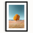 Black-framed landscape art print featuring vibrant fields and lush greenery, set against a neutral mat, enhancing its visual appeal for home decor.