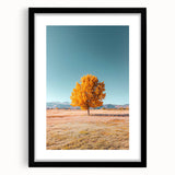 Black-framed landscape art print featuring vibrant fields and lush greenery, set against a neutral mat, enhancing its visual appeal for home decor.