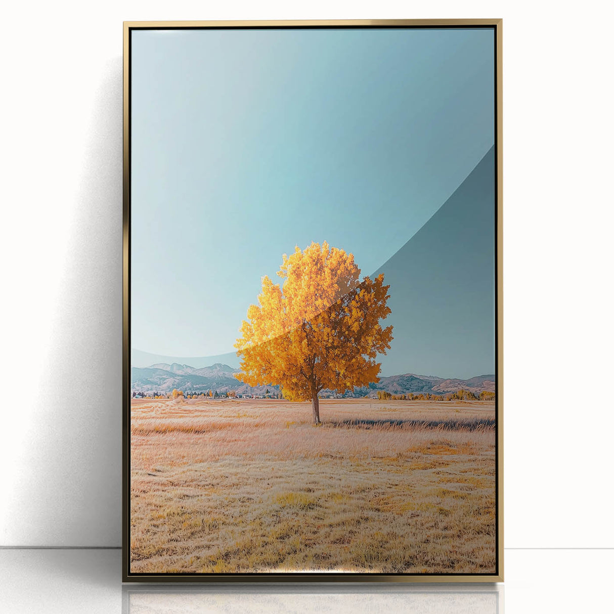 Framed acrylic artwork showcasing a vibrant landscape of golden fields under a clear blue sky, enhancing modern decor with its colorful and serene aesthetic.
