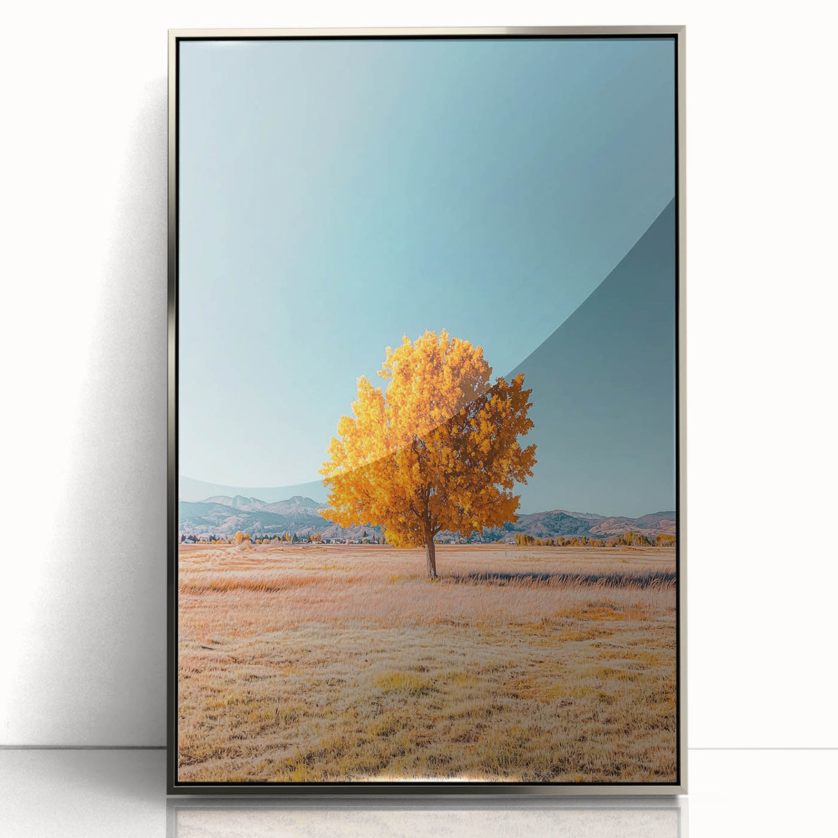 Framed acrylic landscape artwork showcasing a vibrant field scene in shades of green and gold, set in a sleek silver frame, ideal for home decor.