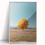 Framed acrylic artwork showcasing vibrant green landscapes with golden fields under a clear blue sky, elegantly presented in a white frame for modern decor.