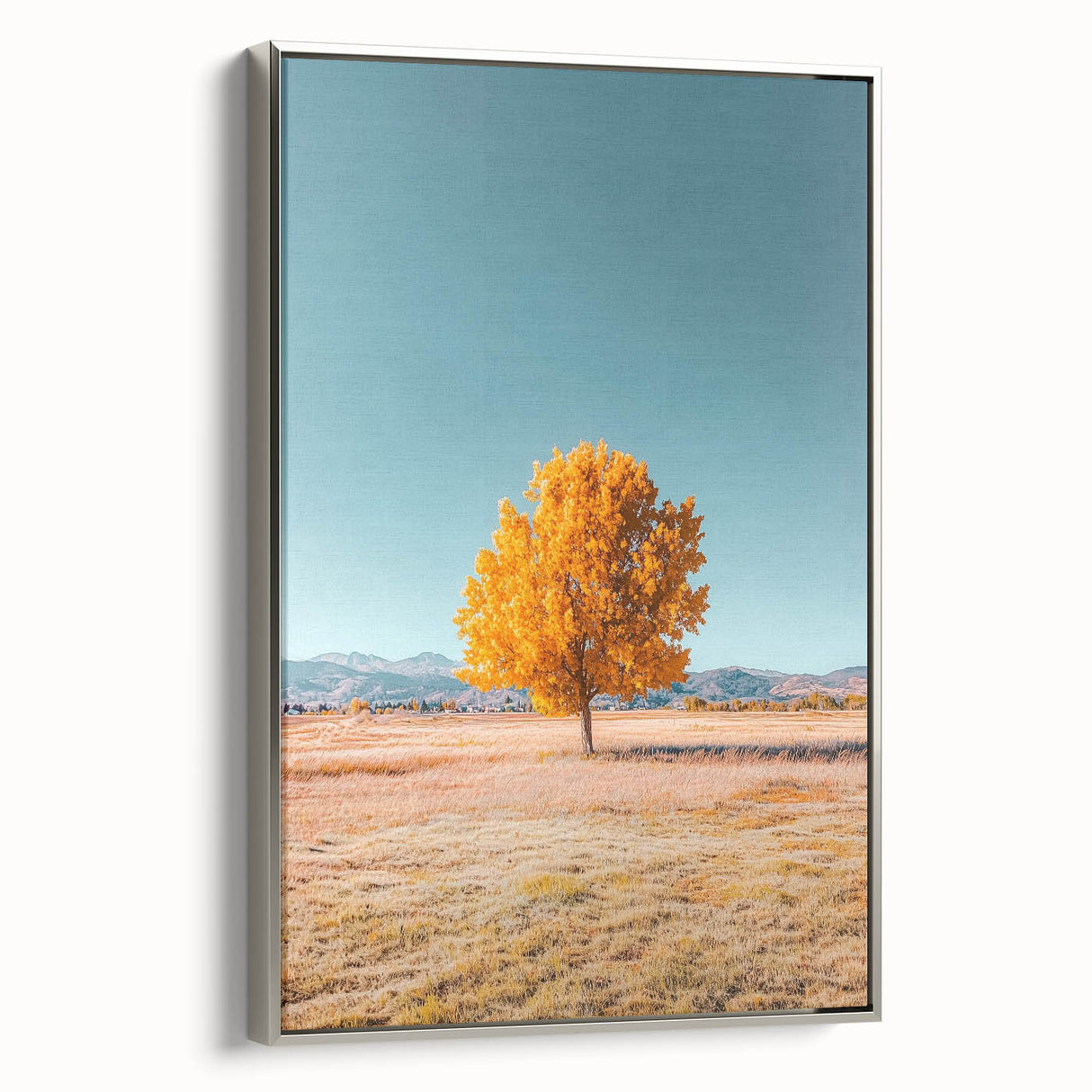 Framed canvas artwork showcasing a serene landscape of fields, featuring vibrant green hues and a silver frame, ideal for enhancing home decor and artistic ambiance.