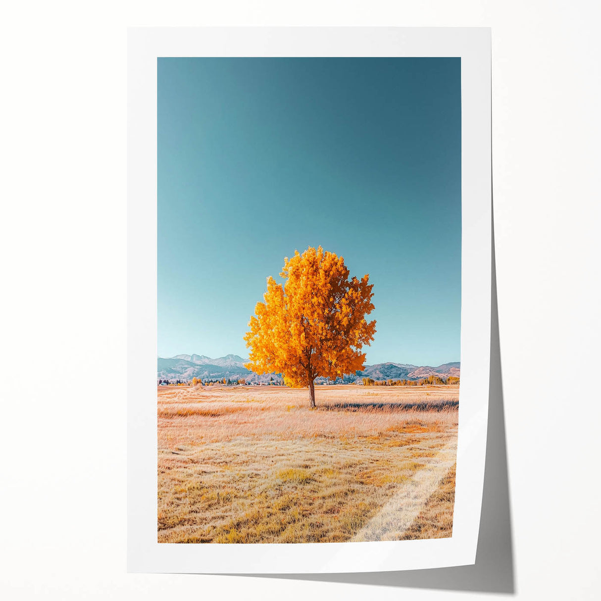 Vibrant landscape print showcasing rolling green fields under a bright blue sky, expertly rolled and packaged in a protective cardboard tube, ideal for home decor.
