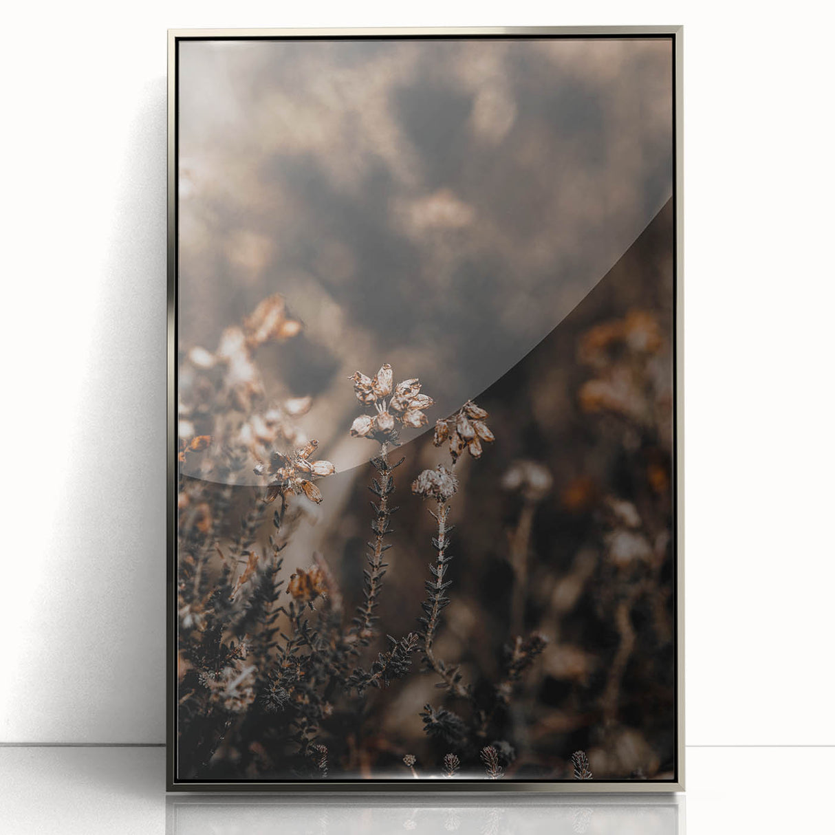 Mid-century modernist art depicting autumn trees in rich orange tones, framed in silver acrylic.