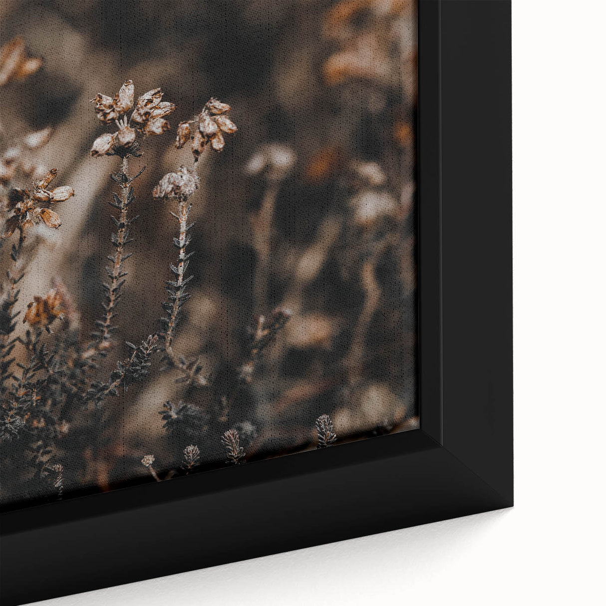 Close-up of a textured, extra-large black wall art on canvas featuring colorful autumn leaves, ideal for living room decor.