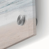 Large abstract wall art in vibrant orange and blue tones on acrylic glass.