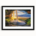 Black-framed landscape artwork depicting a serene cave scene with intricate details and a white mat, ideal for home decor or gallery display.