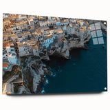 Vibrant acrylic landscape artwork depicting dramatic cliffs in various shades of blue and green, displayed in a sleek glass frame with mounting pins, ideal for modern home decor.