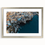 Framed landscape artwork showcasing majestic cliffs in vibrant colors, accented with a silver mat for an elegant touch, perfect for home decor or office spaces.