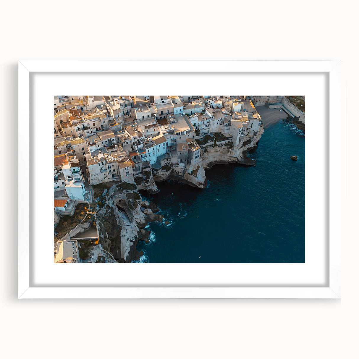Framed landscape artwork showcasing dramatic cliffs and serene nature scene, featuring a white mat border and a sleek modern frame perfect for home decor.