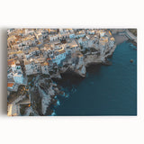 Vibrant stretched canvas artwork showcasing a dramatic landscape with towering cliffs and a serene blue sky, perfect for enhancing contemporary home decor or office spaces.