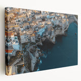 Stretched canvas artwork showcasing a dramatic cliff landscape in vibrant colors, ideal for modern home decor or nature-themed interiors, with a side view perspective.
