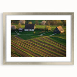 Framed landscape artwork of a barn scene with a silver mat, showcasing rustic charm and elegance, perfect for home or office decor, enhancing any space.