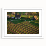 Framed landscape art print of a barn scene with a white mat, showcasing rustic charm and vibrant colors, perfect for home or office decor.
