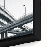 Close-up of a beautifully framed landscape canvas depicting a serene bridge scene, showcasing vibrant colors and intricate details that enhance any home decor.