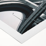 Rolled canvas artwork showcasing a vibrant landscape bridge design with rich colors and intricate details, elegantly packaged in a protective cardboard tube for shipping.