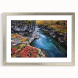 Framed landscape artwork showcasing vivid canyons in rich colors, elegantly matted and presented in a sleek silver frame, ideal for enhancing home decor.