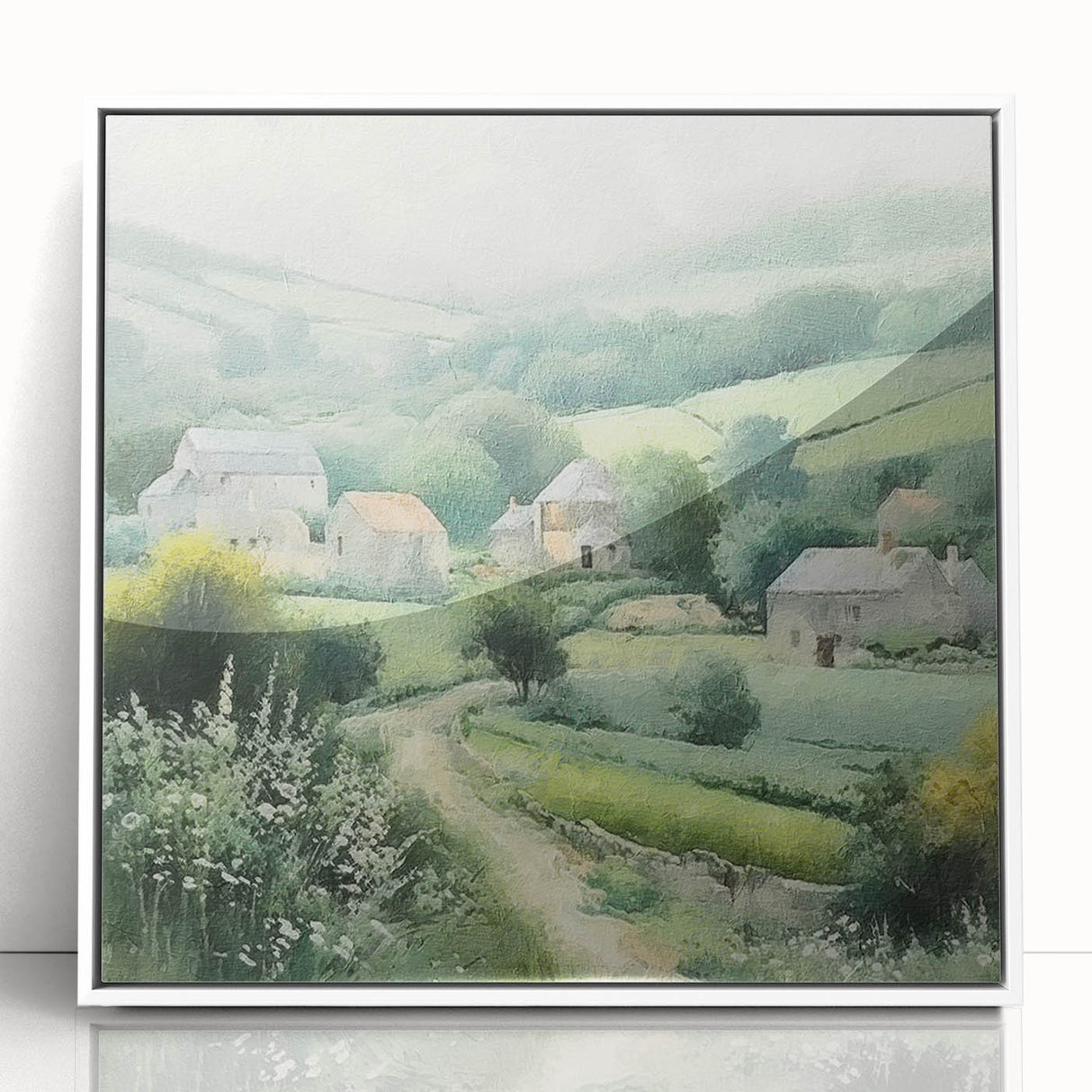 Framed landscape wall art depicting a serene countryside scene with lush greenery and a clear blue sky, featuring a sleek white frame for elegant display.
