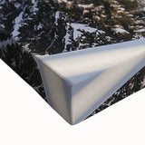 Close-up of a stretched canvas artwork depicting a serene countryside landscape, showcasing vibrant greens and blues with detailed brushwork, perfect for home décor.