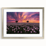 Framed landscape artwork featuring serene green fields under a clear blue sky, surrounded by a sleek silver mat, perfect for enhancing modern home decor.