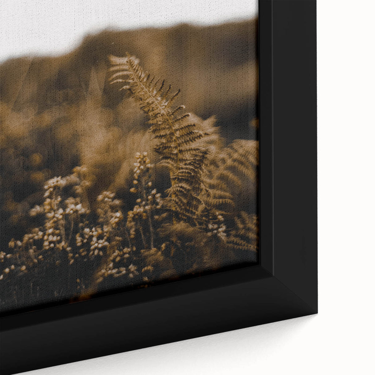 Close-up of a black wall art canvas featuring a textured abstract design with vibrant autumn colors.