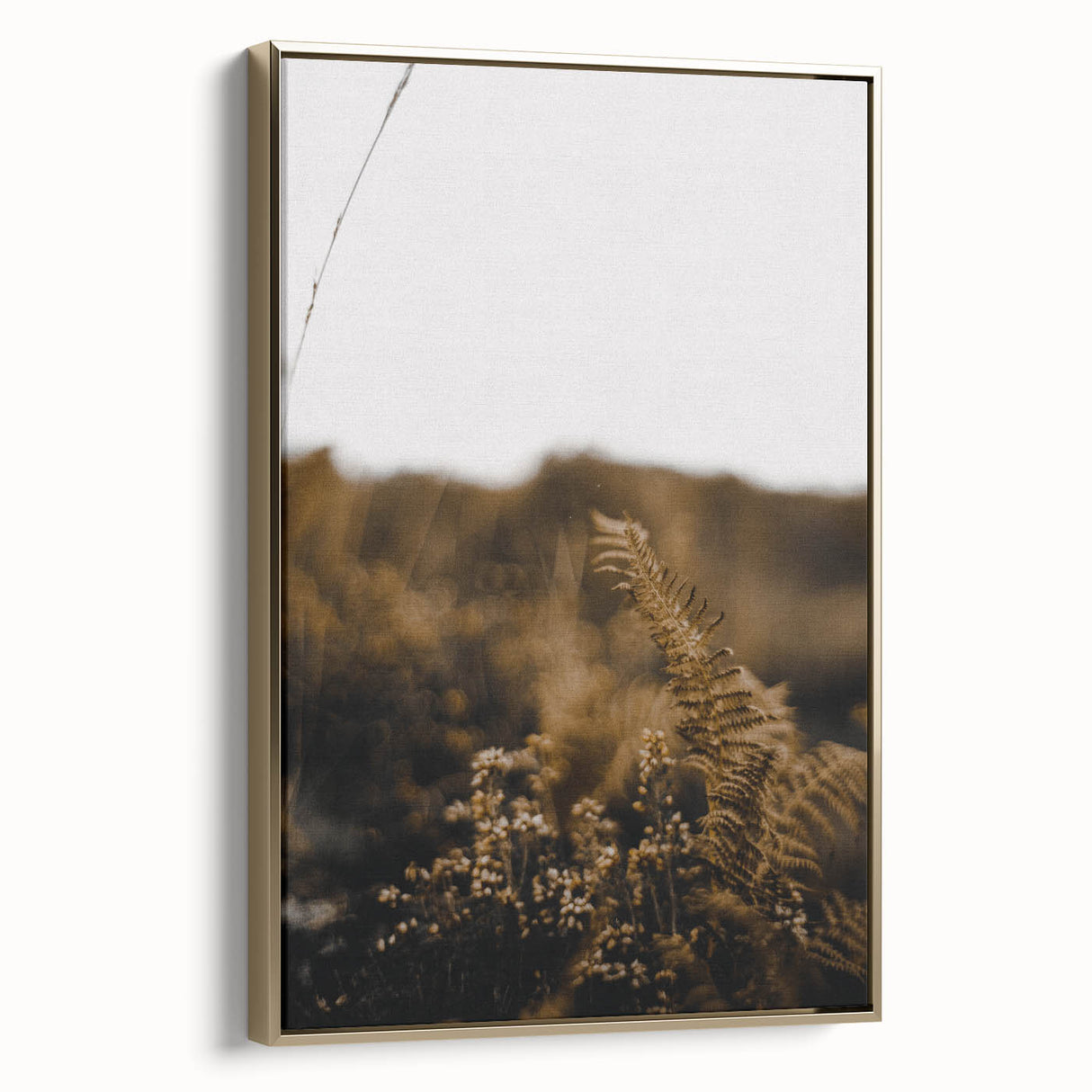 Framed canvas depicting a vintage-style landscape painting with autumnal trees in gold and black tones.