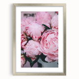 Textured abstract art print in soft green and white hues, framed in silver, ideal for bedroom wall decor.