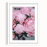 Abstract art print depicting spring with soft pastel shades on a white framed canvas.